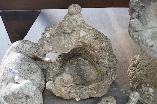 Two reconstituted stone garden bird baths, one moulded with squirrel and five stone garden animal ornaments, largest height 43cm